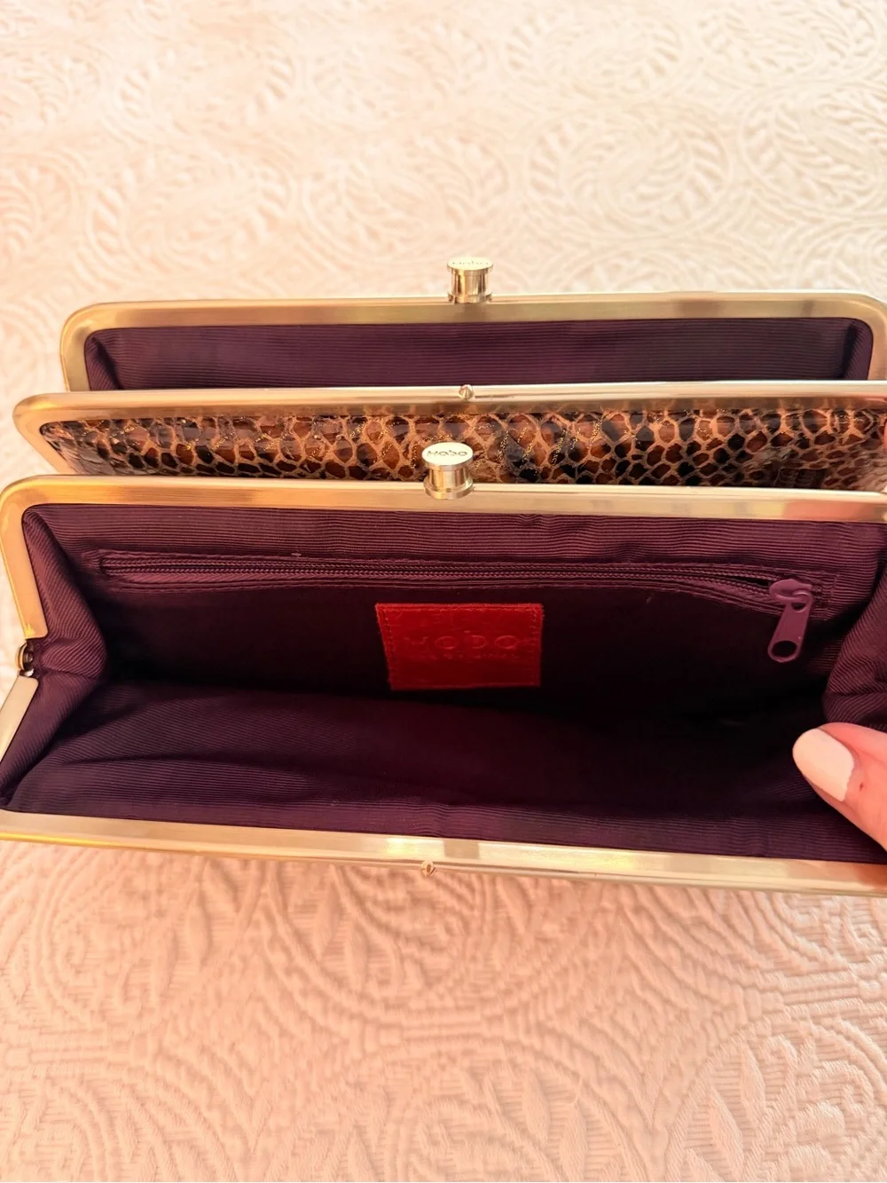 HOBO Animal-Print Snake-Embossed Frame Clutch in Black and Brown